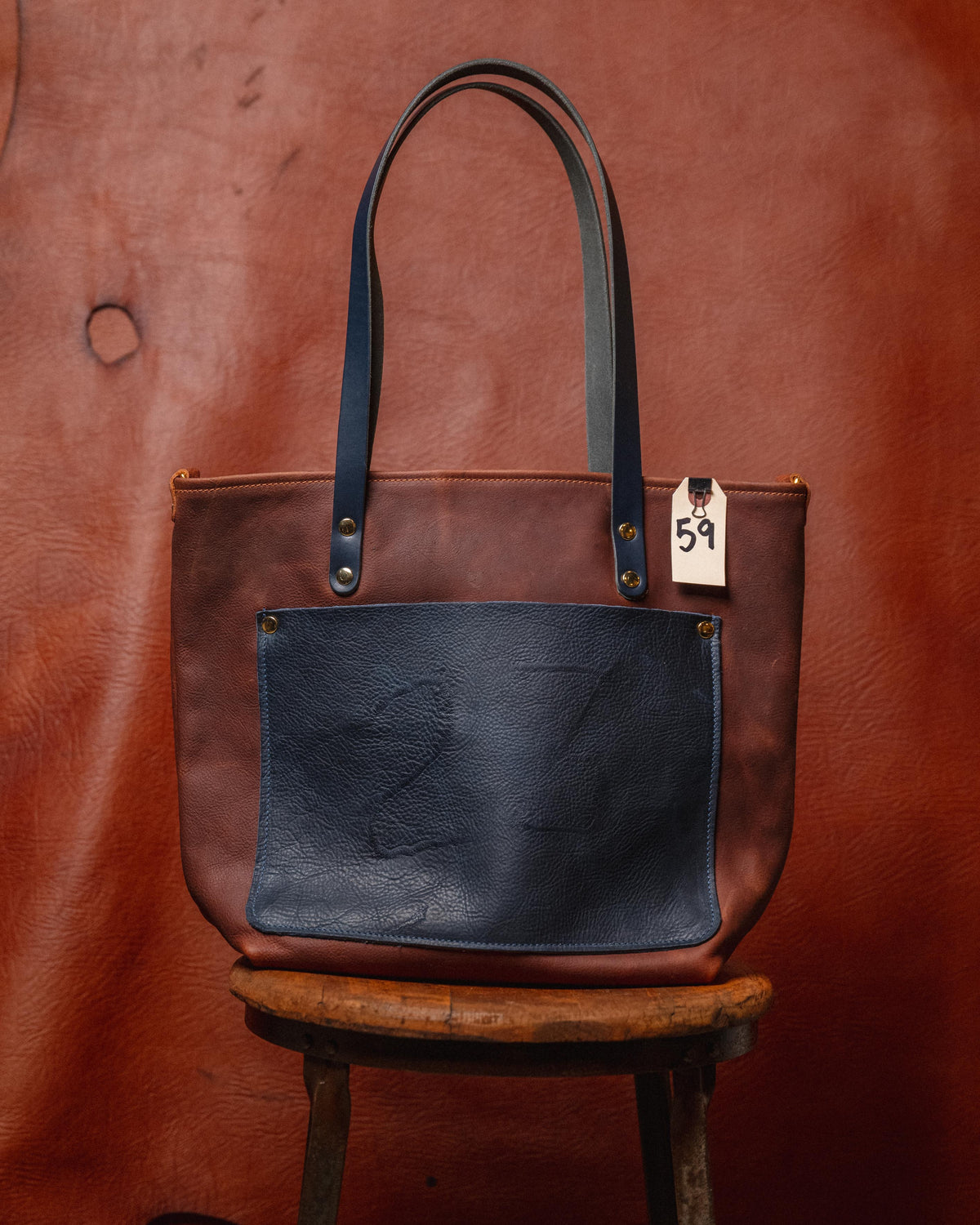 59. Tan / Navy Kodiak Travel Tote with branded pocket and 10” Handles