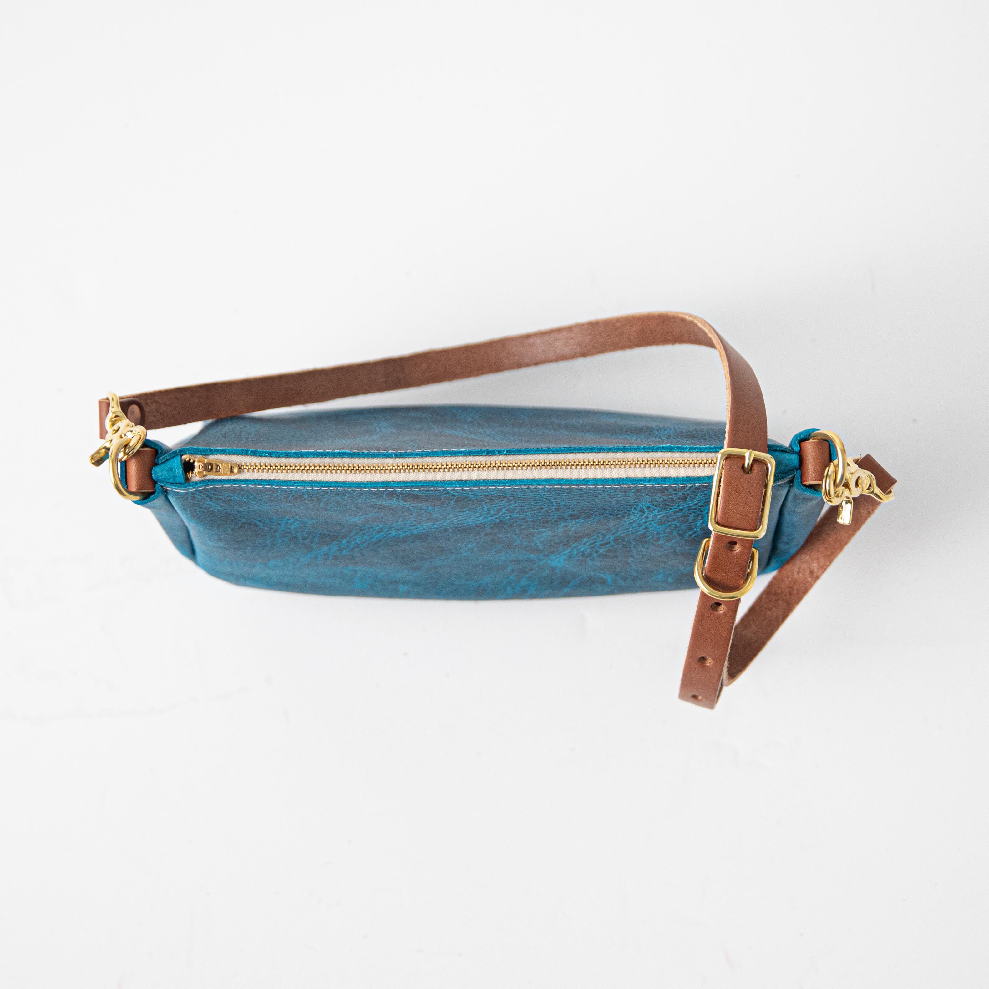 Petrol Blue Bison Crossbody Bag, handmade full-grain leather with solid brass zipper and brown leather strap.
