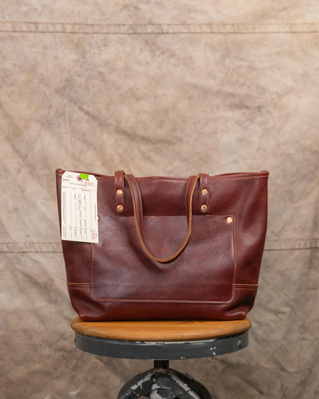 1882 Dark Tan Bulldog East West Panel Tote with exterior pocket and 7” two ply handles