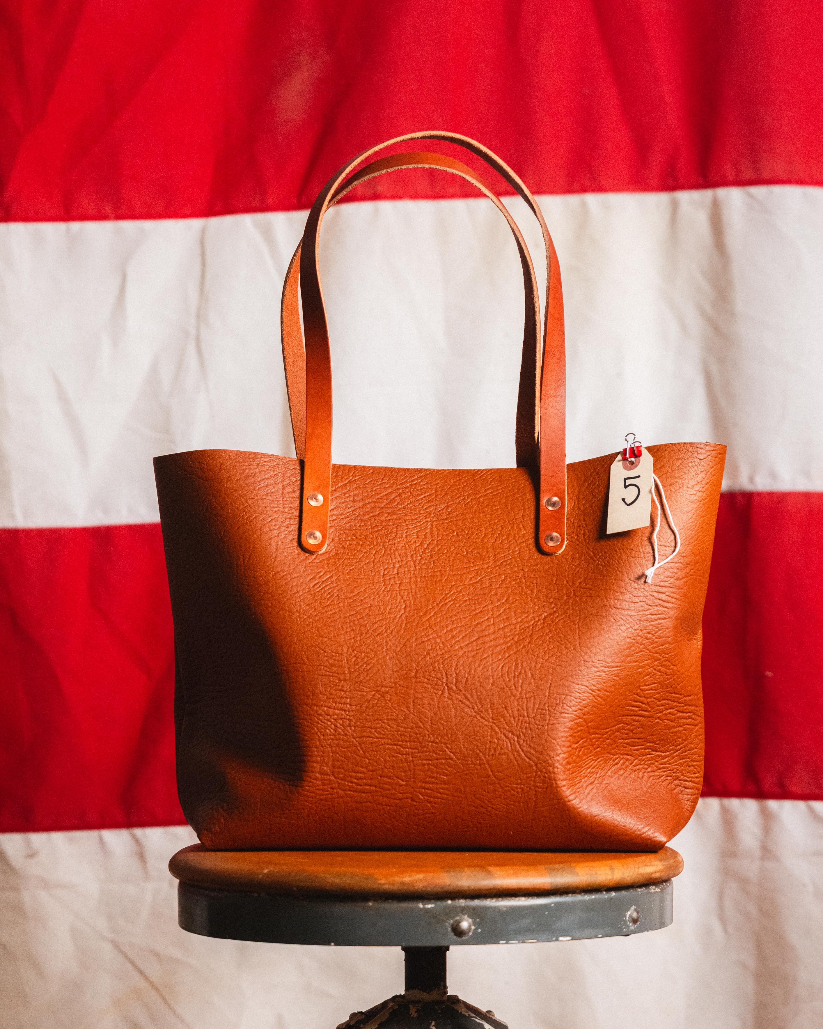 5. Tan Bison East West Tote 10” handles