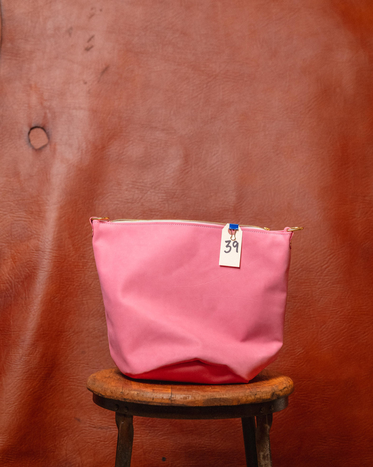 39. Pink Suede Zip Top Bucket Bag