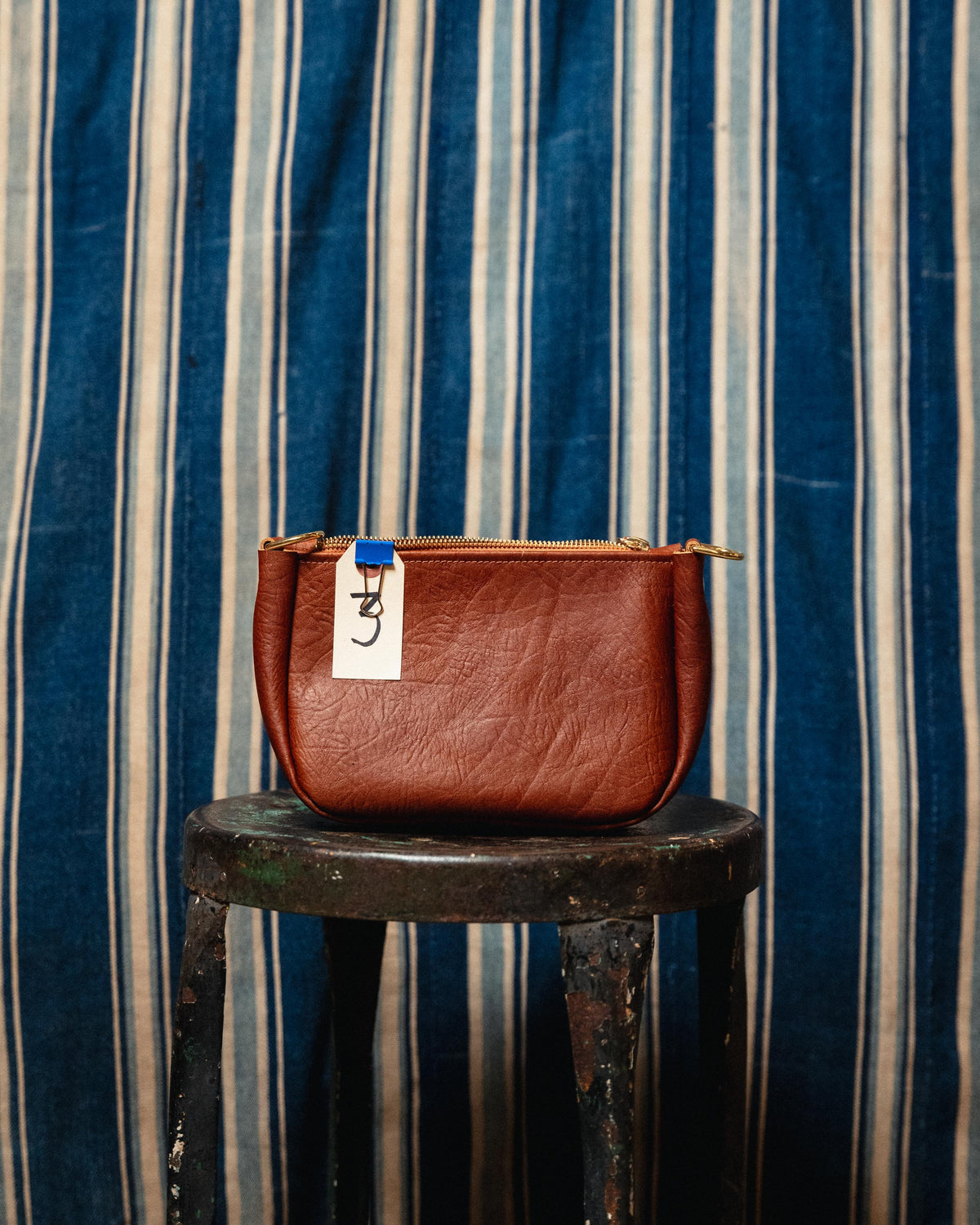 3. Tan Bison Mini Crossbody Bag (has superficial cut on one side that is hard to see)