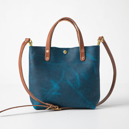 Vibrant Petrol Blue Bison Mini Tote, handmade with full-grain leather, tan handles, and a detachable strap.