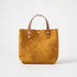 Yellow Bison Mini Tote: vibrant full-grain leather bag with tan handles and heirloom-quality craftsmanship.