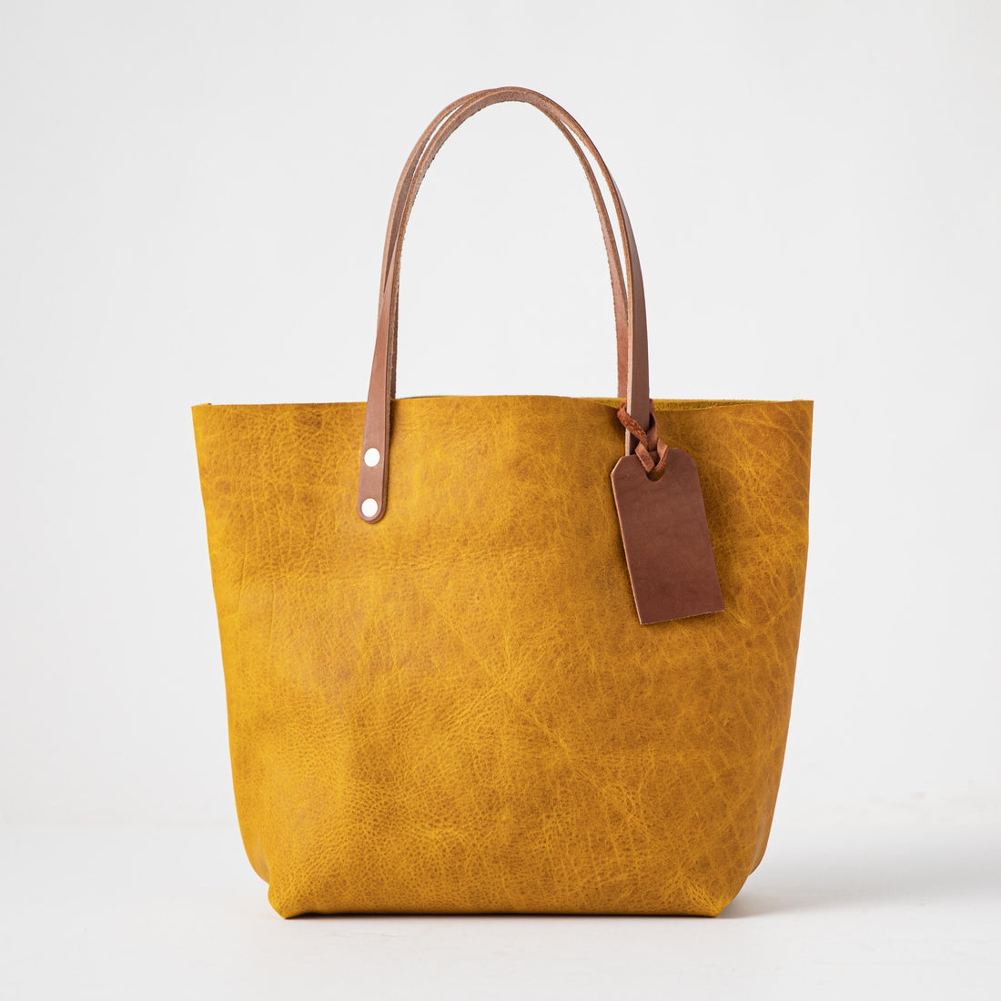 Vibrant Yellow Bison leather tote bag with Tan handles and a brown leather tag.