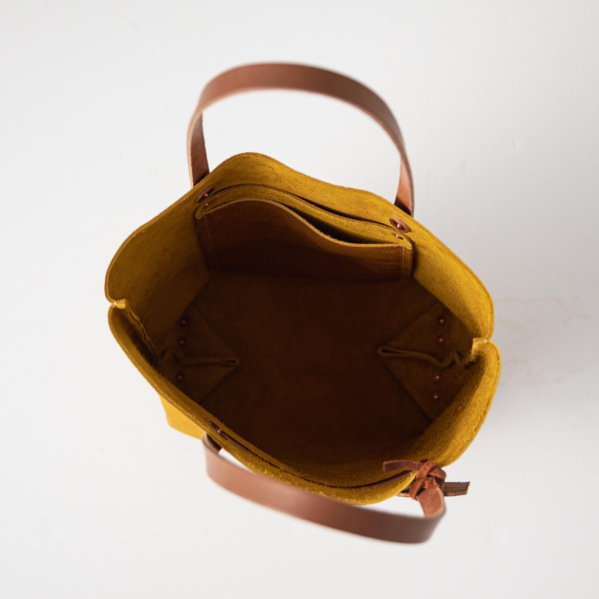 Yellow Bison Tote: vibrant yellow leather, soft temper, prominent grain, tan handles, handmade in USA.