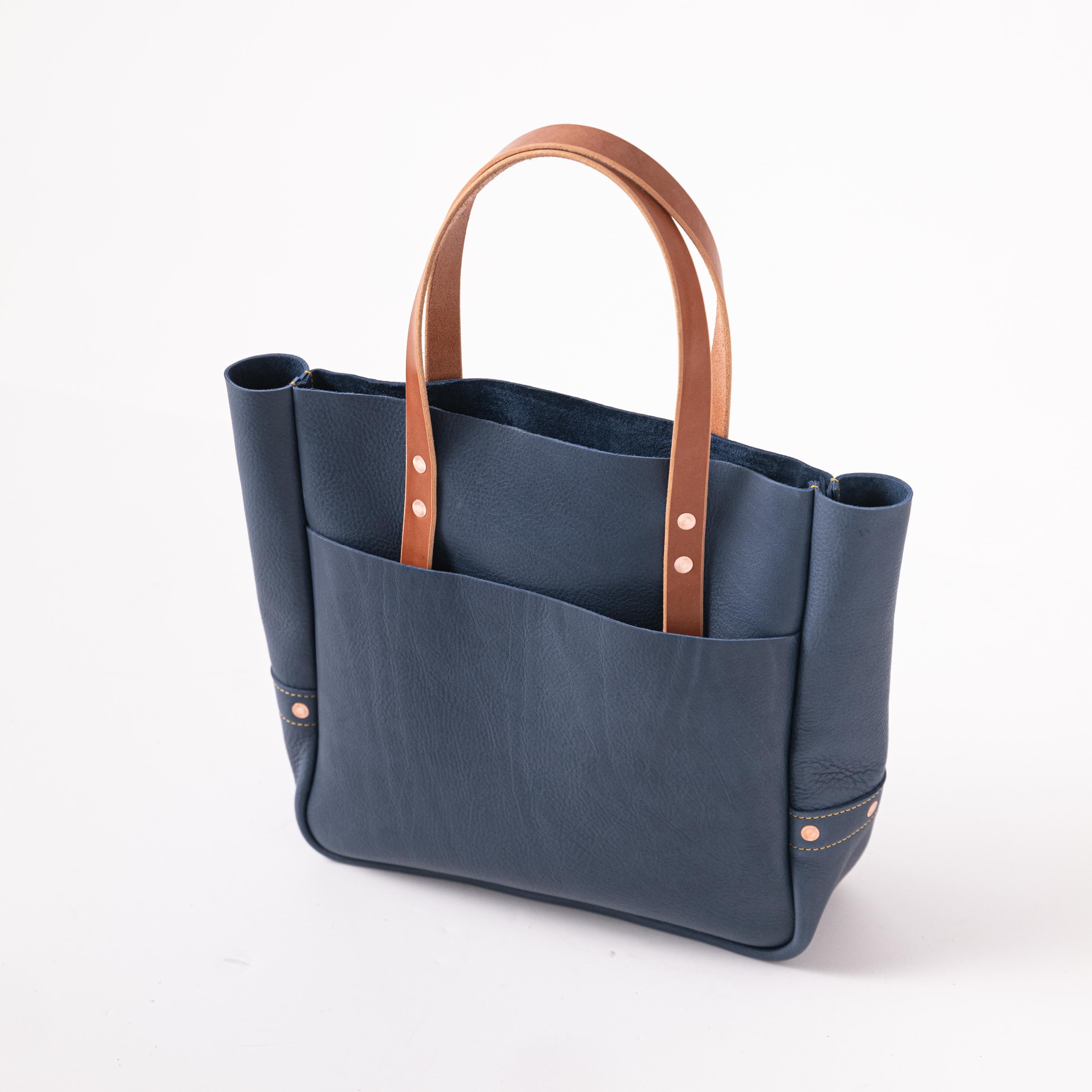 Blue tote bag with brown handles best sale